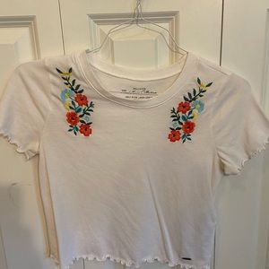 Size small white floral cropped shirt.